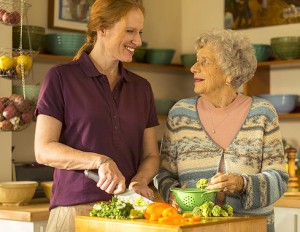 caregiver-cooking-with-senior